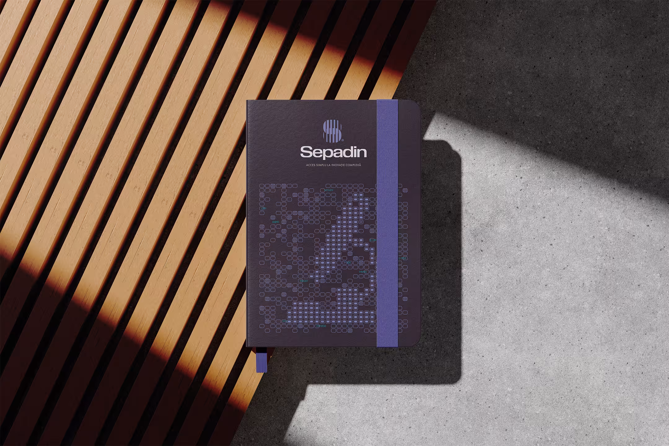 Mockup de agendă cu logo-ul Sepadin aplicat și o ilustrație de brand personalizată.